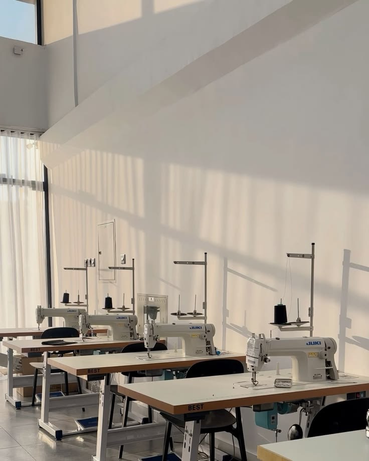 Bright sewing atelier with industrial machines